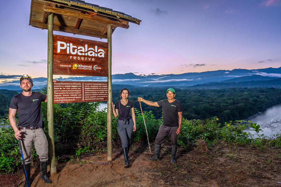 Image showing the Khamai Foundation team standing besides the Pitalala Reserve signpost