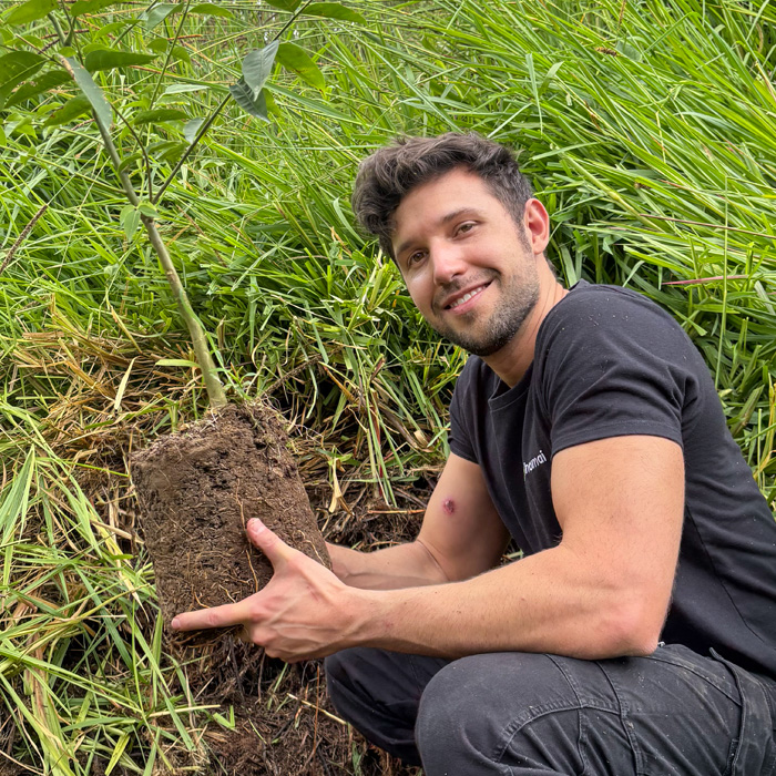 Image showing biologist Alejandro Arteaga at the Arlequín Reserve during a reforestation campaign